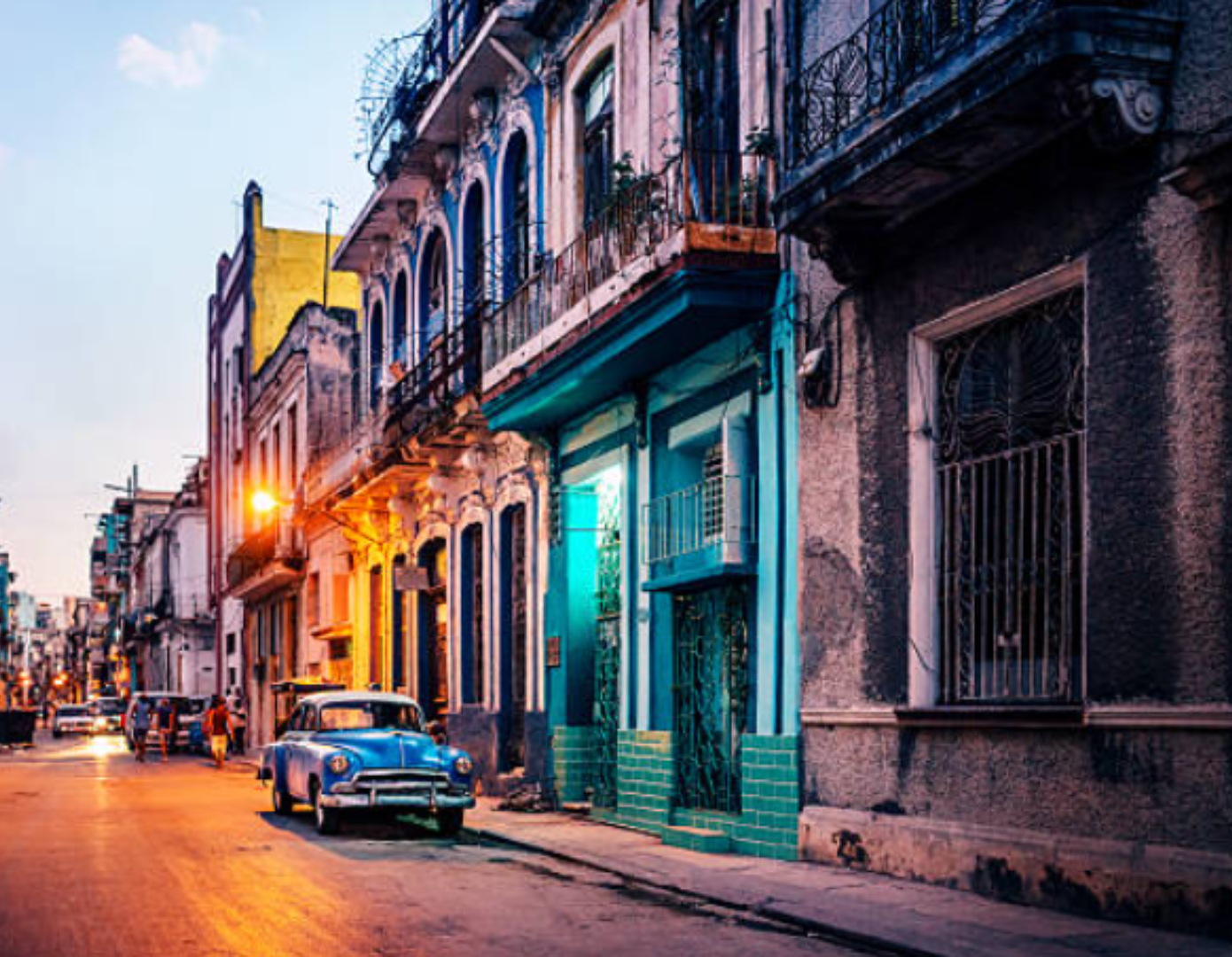 A photo of a vintage car on a street in Havana