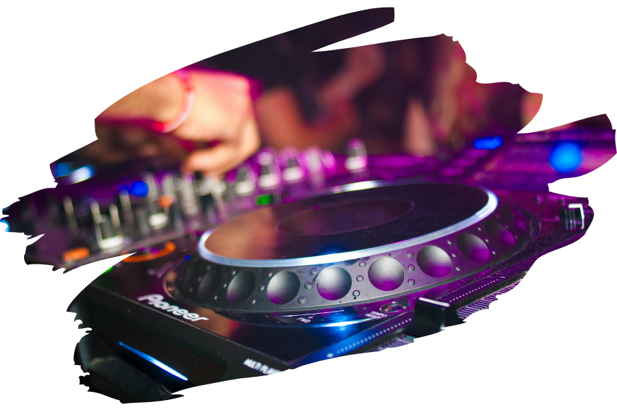 A photo of a DJ turntable at a nightclub with a DJ mixer in the background.