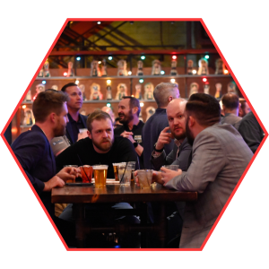 Men sitting at table with drinks discussing business